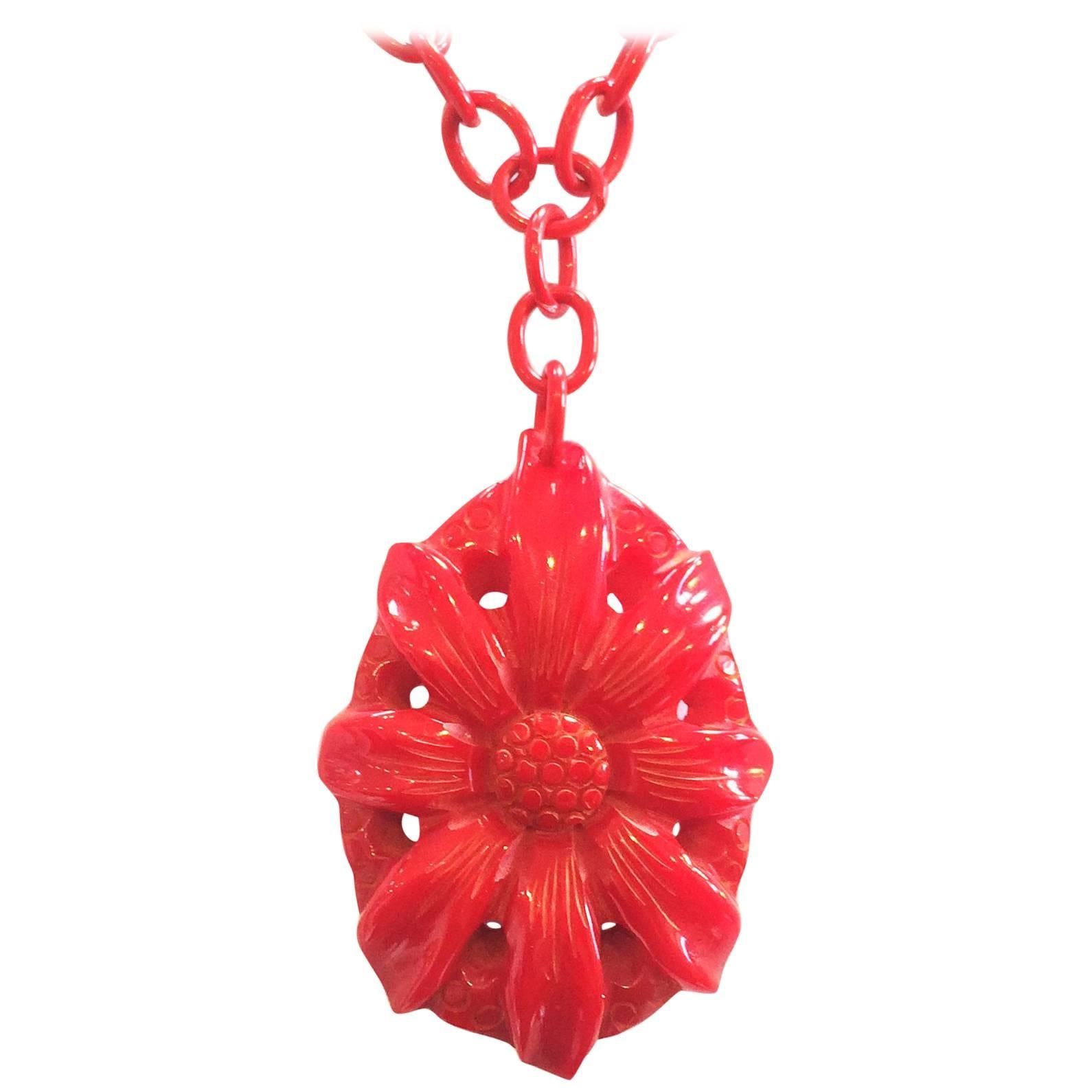Art Deco heavily carved red bakelite pendant necklace on celluloid chain
