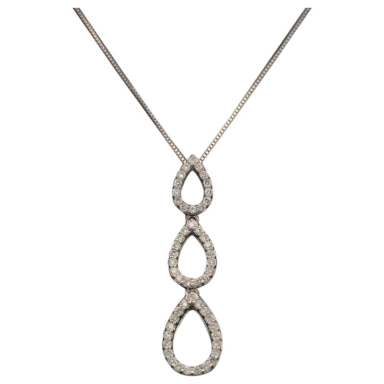 Collana d'oro vintage con tripla goccia a lacrima e pavé di diamanti