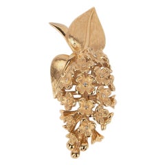 Christian Dior Broche en métal doré