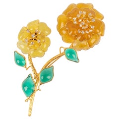Broche Flor Agustín en metal dorado