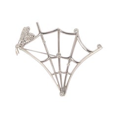 Dior Broche argentée en métal argenté avec strass Swarovski