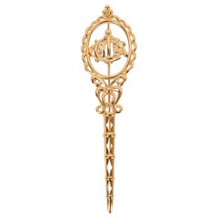 Dior Broche longue en métal doré
