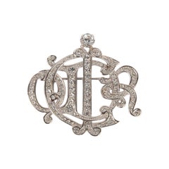Broche plateado Dior con brillantes
