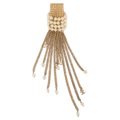 Chanel Broche Cruise en métal doré avec perles et strass, 2001