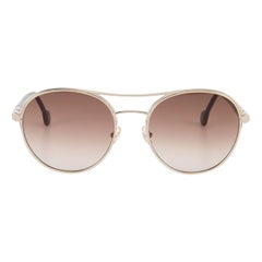 Occhiali da sole con montatura in oro e lenti sfumate di Salvatore Ferragamo