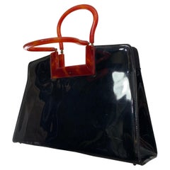 1950er Jahre Schwarz glänzende Lackhandtasche mit Griffen und Rahmen aus Schildpattimitat