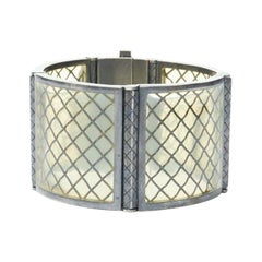 BOTTEGA VENETA brazalete puño de plata de ley amarillo pálido intrecciato plexi