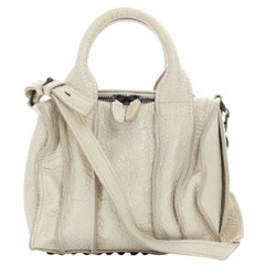 ALEXANDER WANG Rockie, borsone piccolo in pelle di ciottoli grigia con base di borchie nere