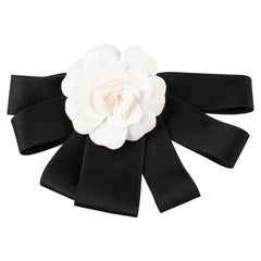 Chanel Black Ribbon Brooch with a White Camellia