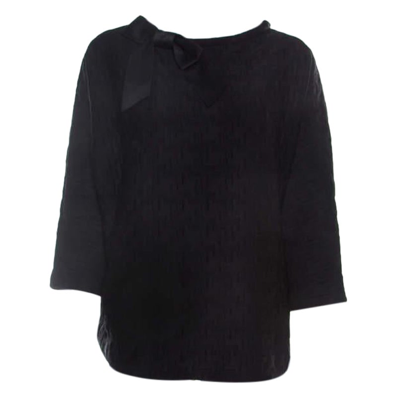 Carolina Herrera Top negro de neopreno elastico con detalle de lazo en el cuello L en venta en 1stDibs
