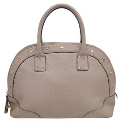 MCM Borsa Alma con manico superiore a cupola in pelle beige con borchie