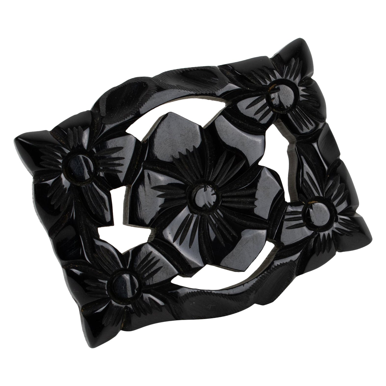 Art Deco Bakelite Brooch with Floral Carving For Sale