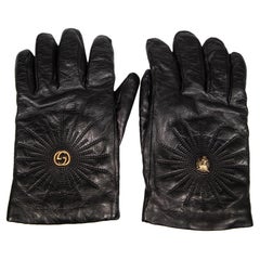 Guanti Gucci in pelle nera con testa di tigre GG
