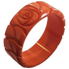 Art Deco solid orange carved bakelite bangle bracelet