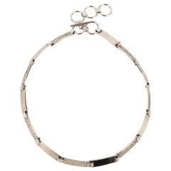 Moschino  Ceinture en métal argenté
