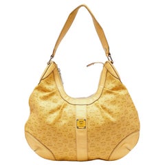 MCM Visetos hobo en toile et cuir enduite jaune