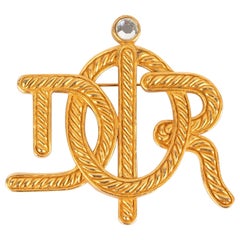 Goldene Metallbrosche von Dior