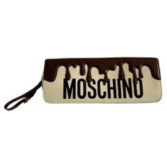 SS22 Moschino Couture Chocolate Dripping Wristlet Handbag by Jeremy Scott