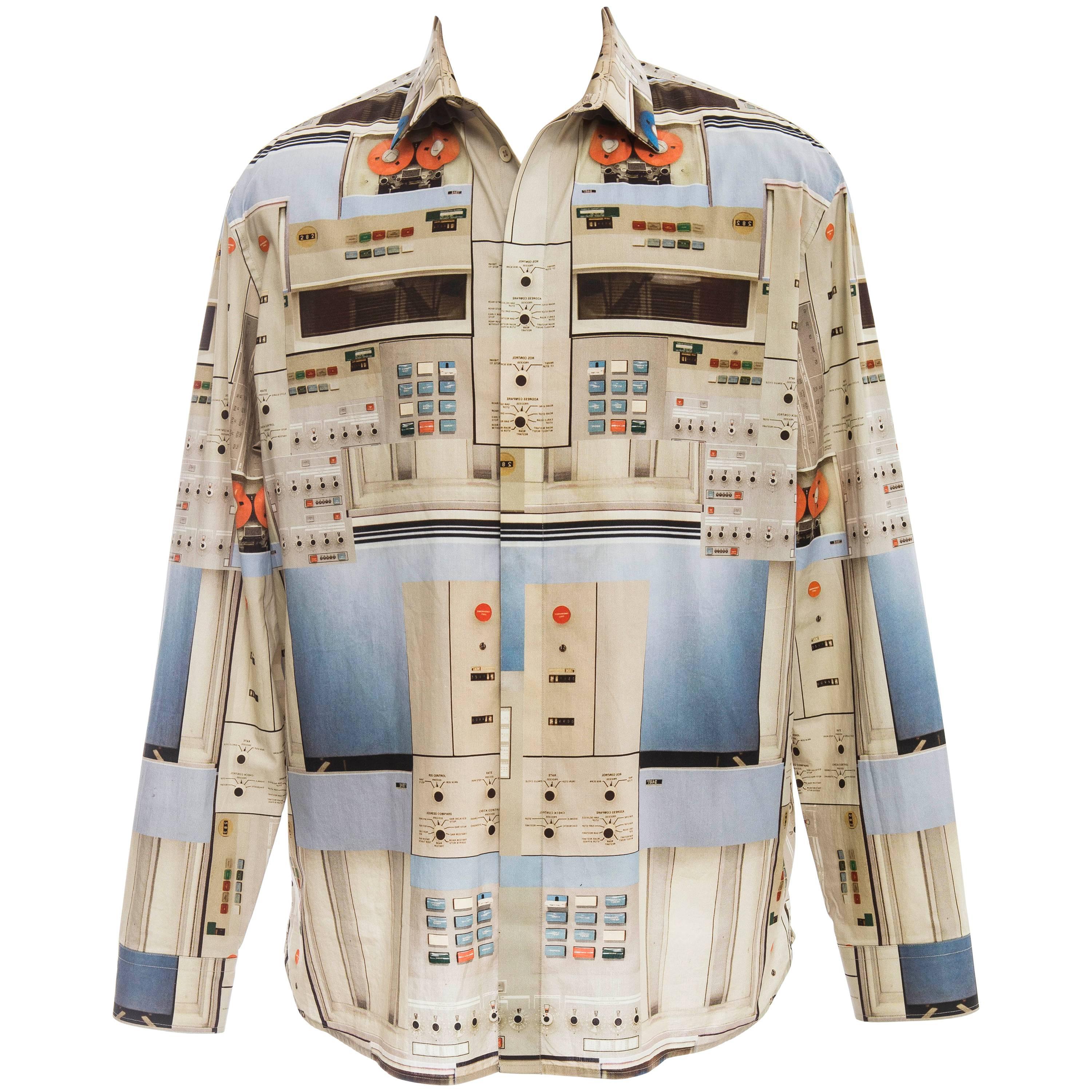 Givenchy by Riccardo Tisci, Spring-Summer 2014 Men's cotton long sleeve shirt with pointed collar, single barrel cuffs, cassette print throughout and button closures at center front.

IT. 41
US. 16

Chest: 50, Length 32, Sleeve 35, Neck 16
