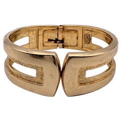 Christian Dior Bracciale rigido vintage in metallo dorato con chiusura a polsino
