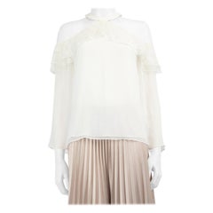 Alice + Olivia Top blanco con hombros recortados Talla M