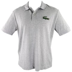 LACOSTE Polo gris en coton ajusté taille M