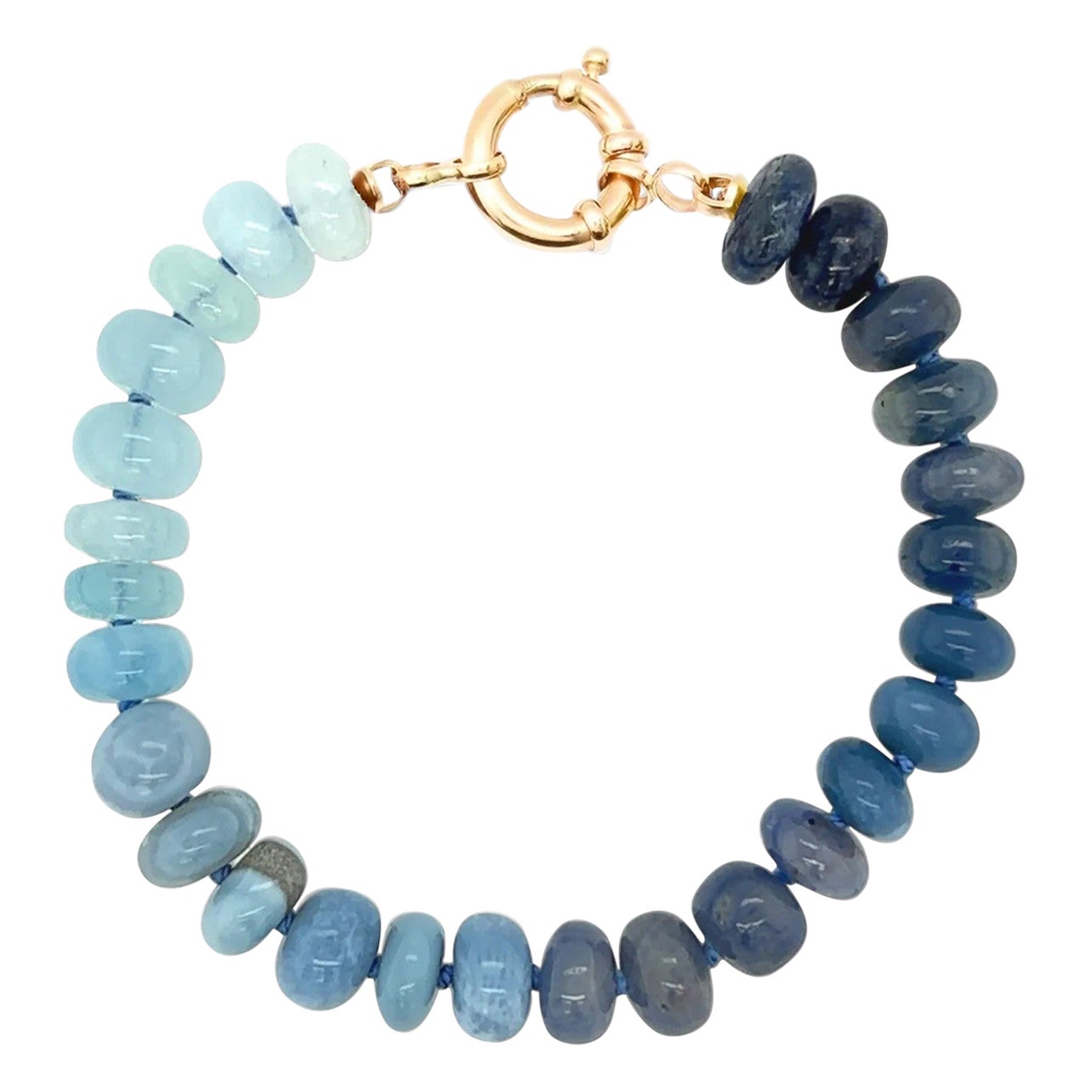 The perfect blue multi gemstone bracelet, methiciously handknotted on silk. An ocean breeze of precious gemstones around your wrist! This beauty is made of  7-8mm polished gemstones such as;

• Arizona Turquoise
• Opal
• Larimar
• Lapis Lazulli
•