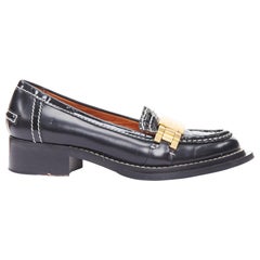 ACNE STUDIOS Mocasines con pespunte negro y hebilla dorada EU38