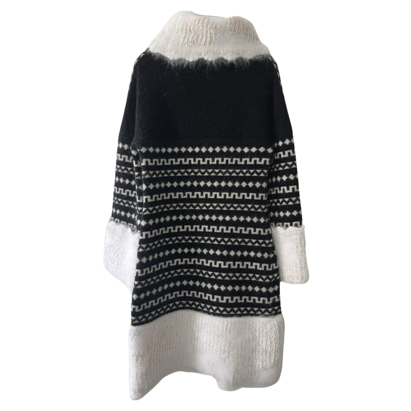 Charming Chanel fluffy Angora dress from ARCTIC ICE Collection by Karl Lagerfeld.
- CC logo charm at side
Size mark 36 FR. Pristine condition.