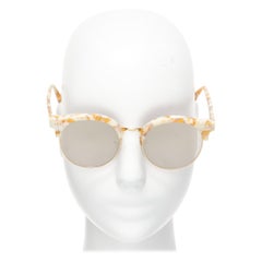 Lunettes de soleil GENTLE MONSTER TOME Supernature gold black cateye reflective purple