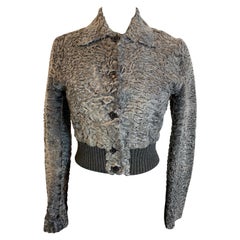 Prada crop top bomber jacket in gray astrakhan fur.