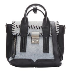 3.1 PHILLIP LIM Bolso bandolera Pashli de cuero negro con pespunte en tejido vaquero azul lavado