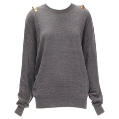 GIVENCHY Riccardo Tisci jersey de lana de alpaca gris con puño de metal dorado S