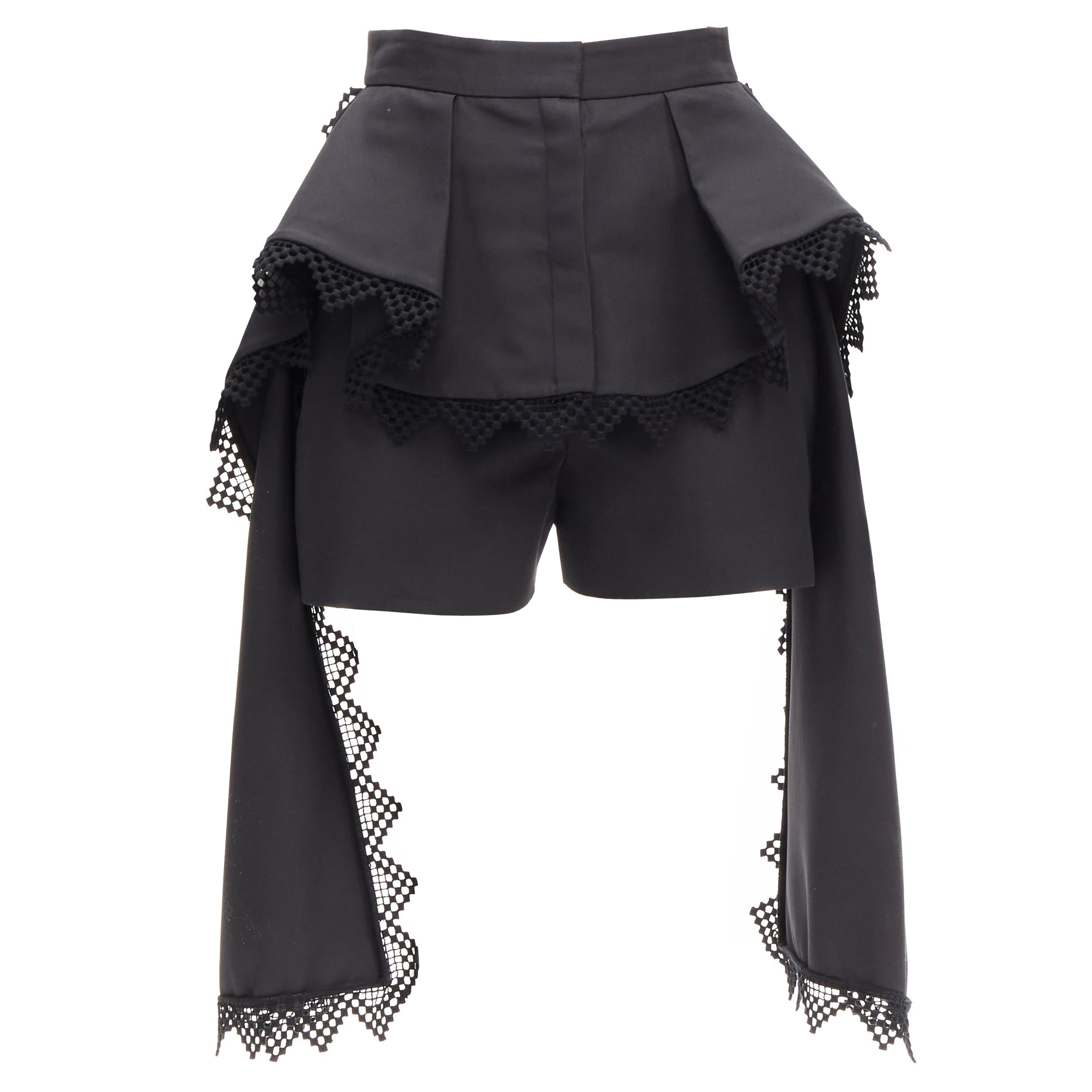 ALEXANDER MCQUEEN - Short noir drapé en treillis avec péplum superposé, taille IT 38 XS