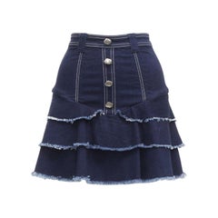 AJE - Jupe en denim bleu à bords effilochés et boutons argentés martelés UK6 XS