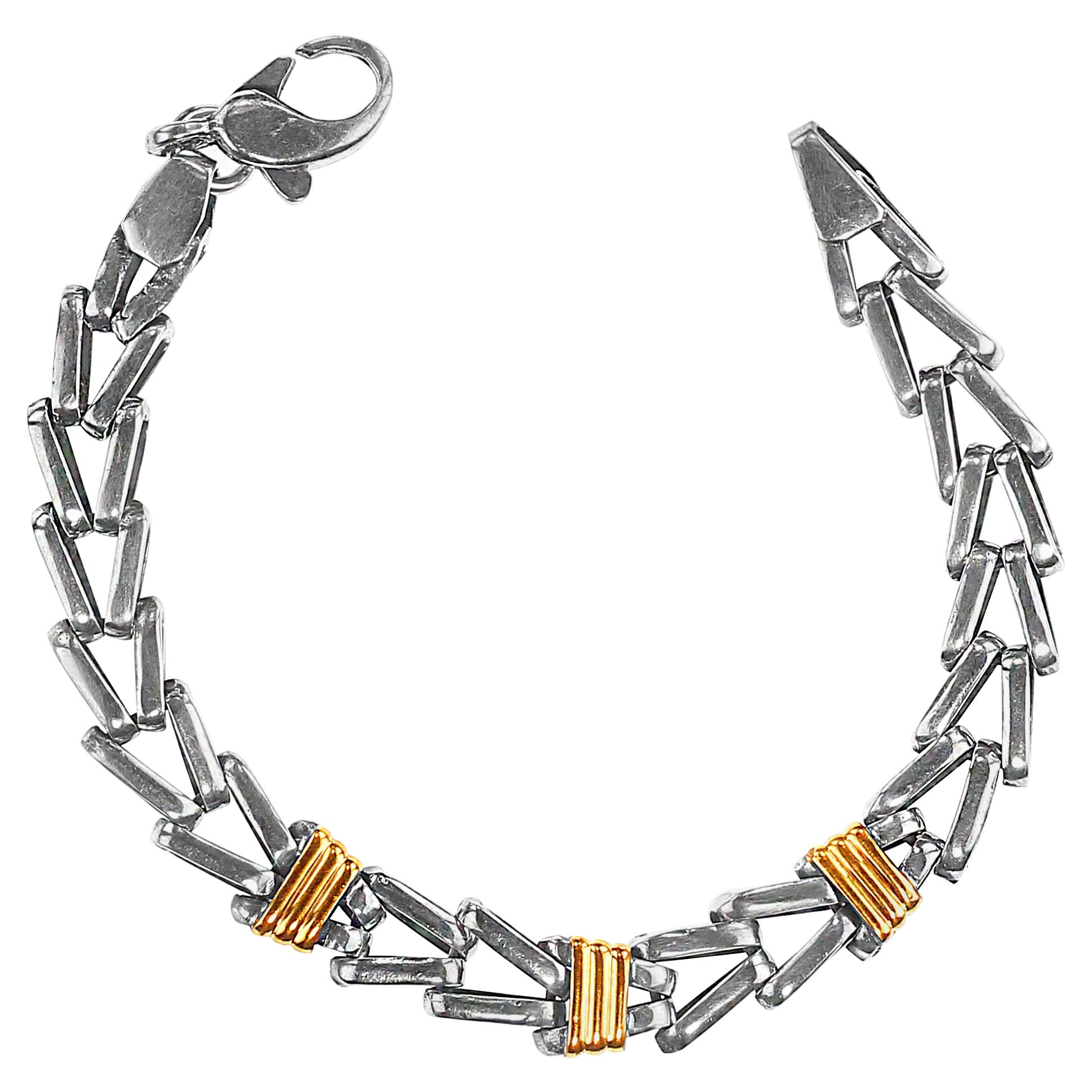 Unique Sterling Silver Herringbone Bracelet with Goldy Accents – 7.13 Inches
Step up your jewelry game with this exquisite 7.13-inch sterling silver herringbone bracelet, designed with precision and elegance in mind. This unique piece combines the