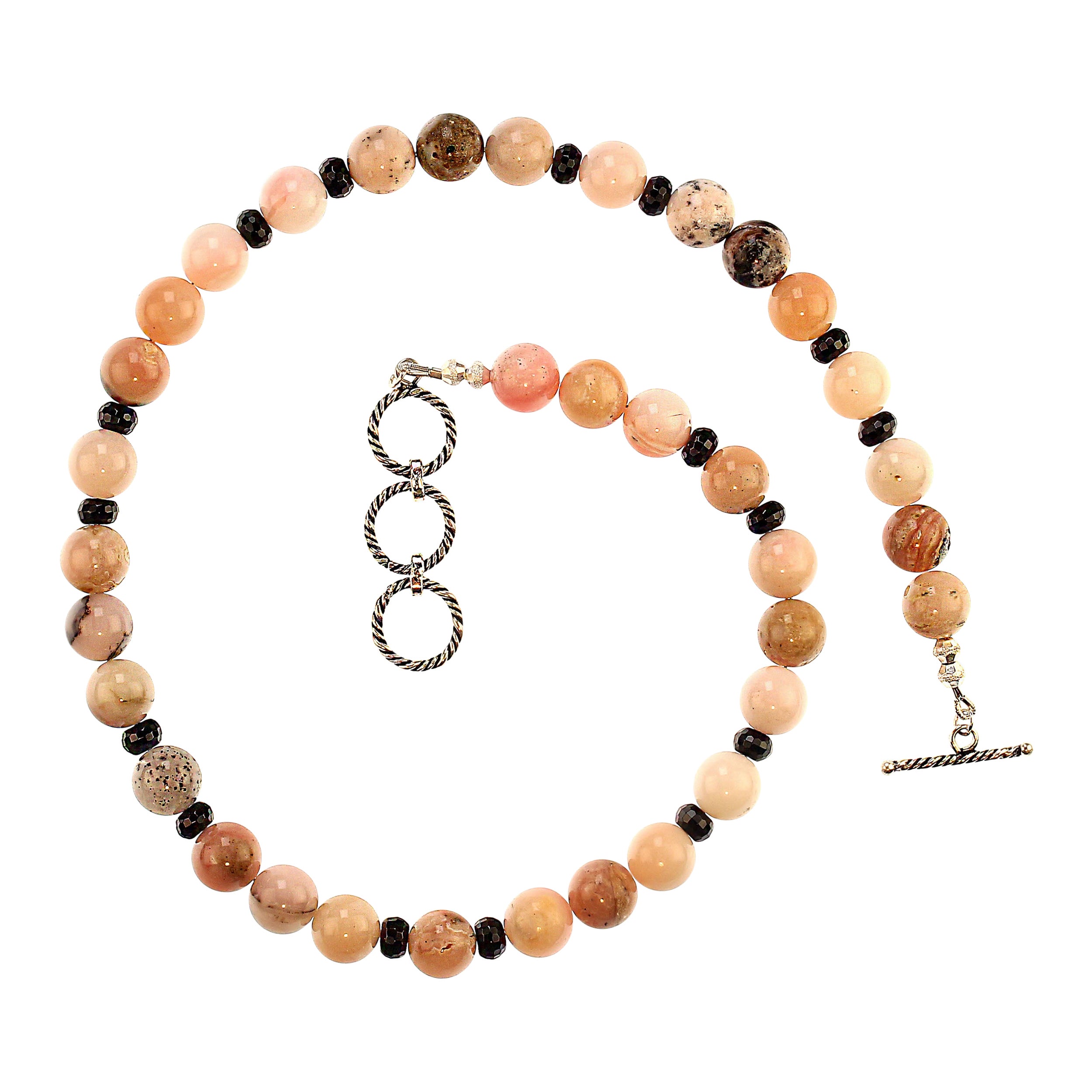 Collana di opale peruviano rosa da 19 pollici con onice nero e chiusura a ginocchiera in argento di Bali

Aggiungi un tocco di eleganza alla tua collezione con questa esclusiva collana di opale peruviano rosa di 19 pollici. Ogni gemma opale liscia
