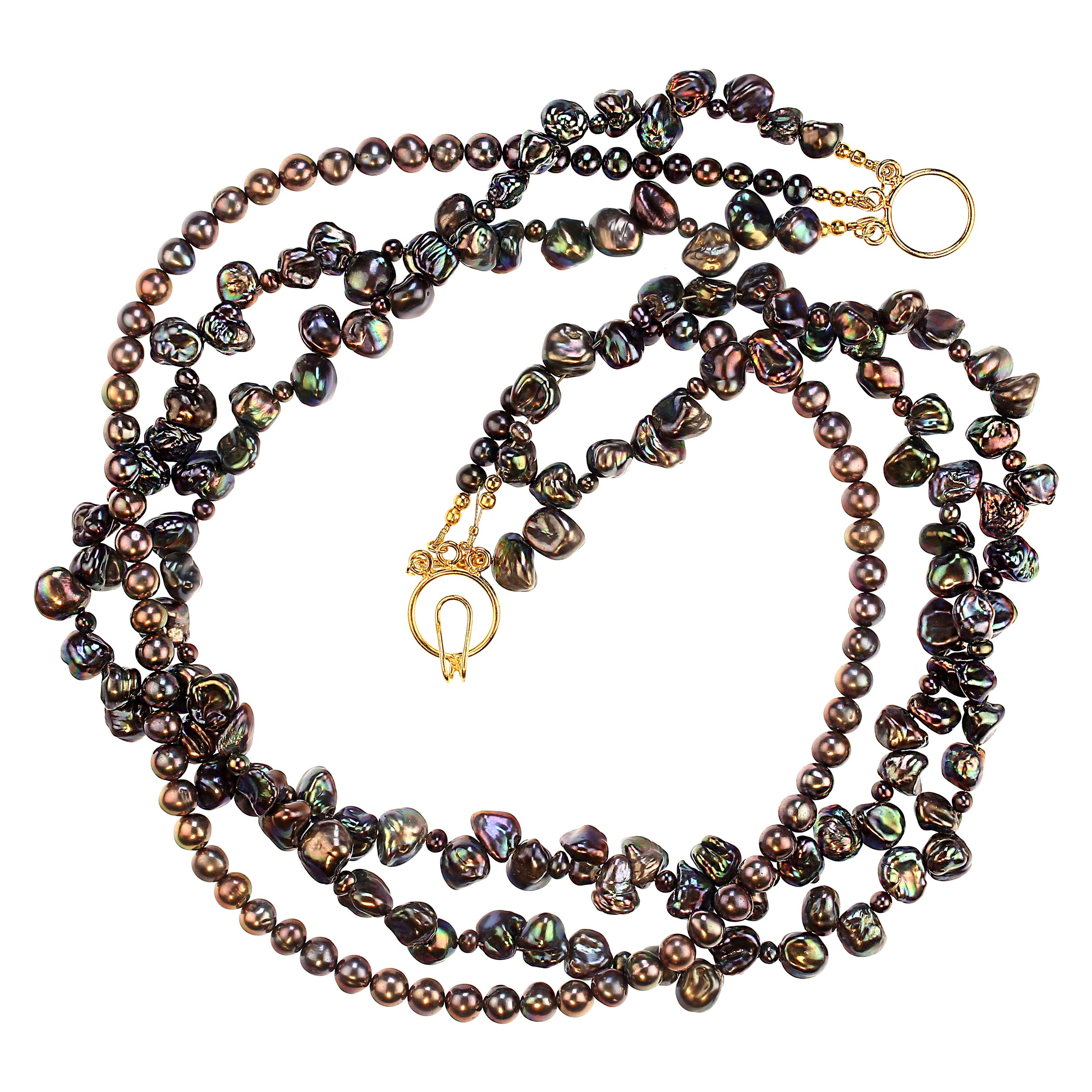 Collier à trois brins de 21 pouces avec perles de paon
Découvrez l'élégance de ce superbe collier à trois brins composé d'un mélange de perles de paon et de perles d'Eleg. Cette pièce d'apparat combine :

Deux rangs de perles Keshi associées à de