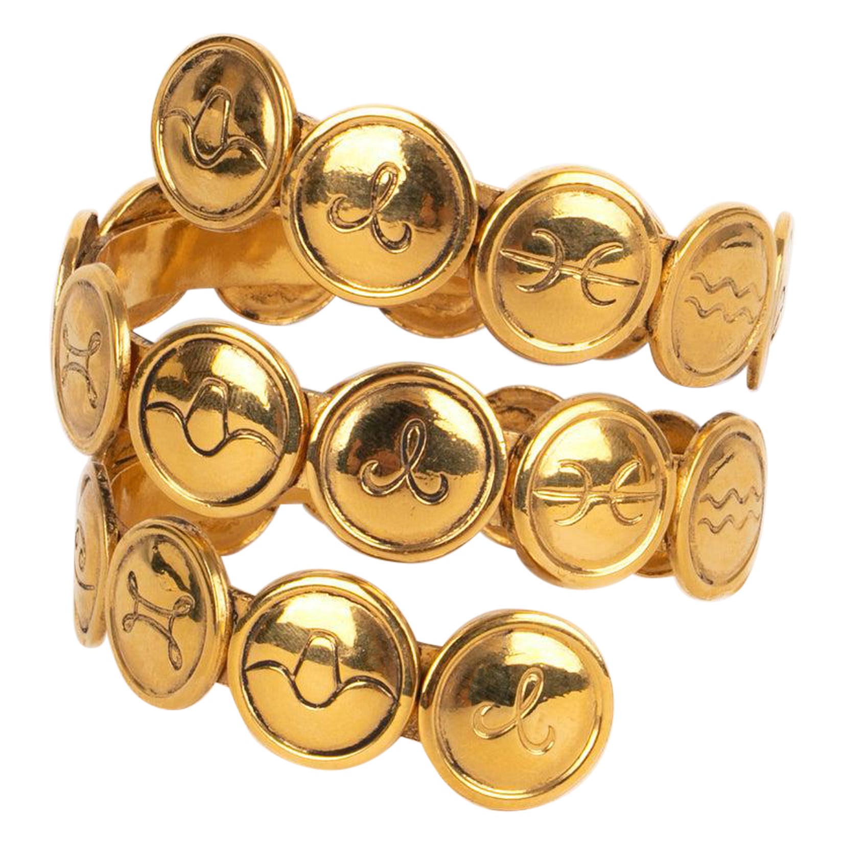 Chanel Astrología Pulsera espiral de metal dorado, años 90