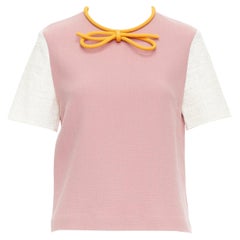 Top con fiocco arancione in misto lana e cotone rosa polveroso di Roksanda