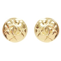 CHANEL gold tone diamond quilted CC logo medallion coin clip on earring