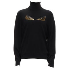 FENDI Rollkragenpullover aus 100% Kaschmir mit schwarzem Perlenstecker und Monster-Augen  IT50 L