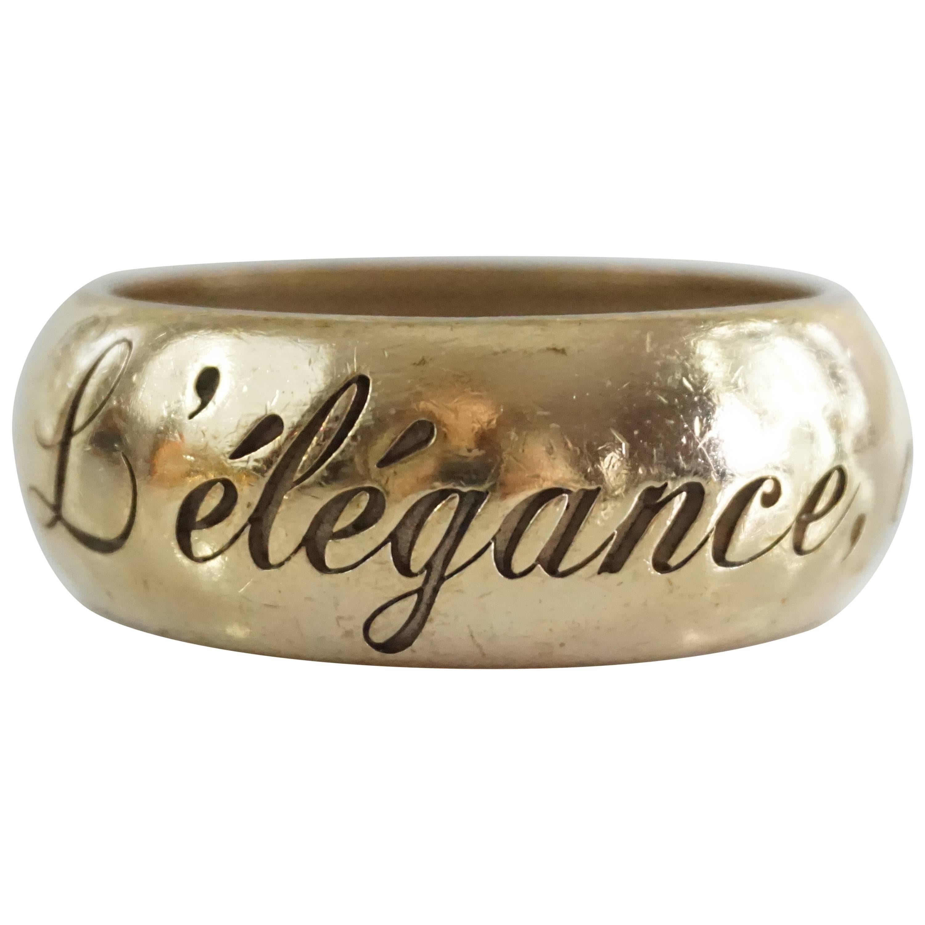 Chanel Goldtone "L'elegance, c'est la ligne" etched thick bangle - 2007P