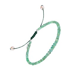 Natural, untreated emerald beaded bracelet with drawstring closure and pearls