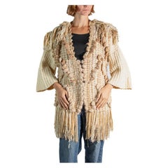 Pull en coton beige à franges