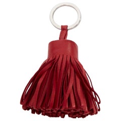 HERMES Milo Carmen red leather tassel silver ring bag charm