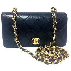 Vintage CHANEL black lamb leather mini shoulder bag, classic 2.55 bag with CC.