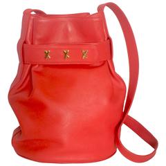 Vintage Paloma Picasso red leather hobo bucket style shoulder bag.