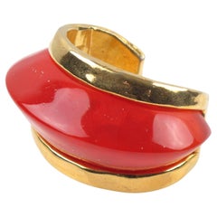 Pulsera brazalete masiva de resina dorada y naranja