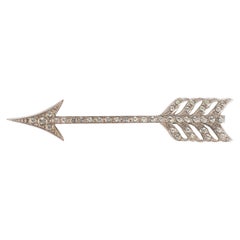 Yves Saint Laurent Broche de metal plateado con brillantes de Swarovski